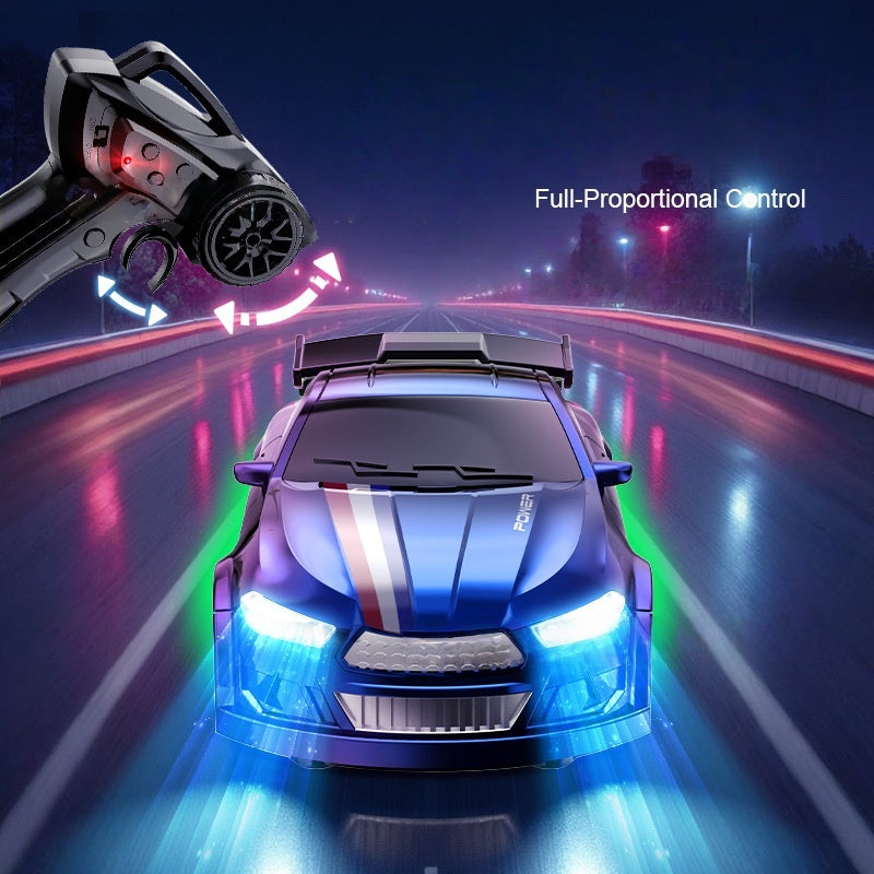 Toy car with remote control on a neon-lit road at night