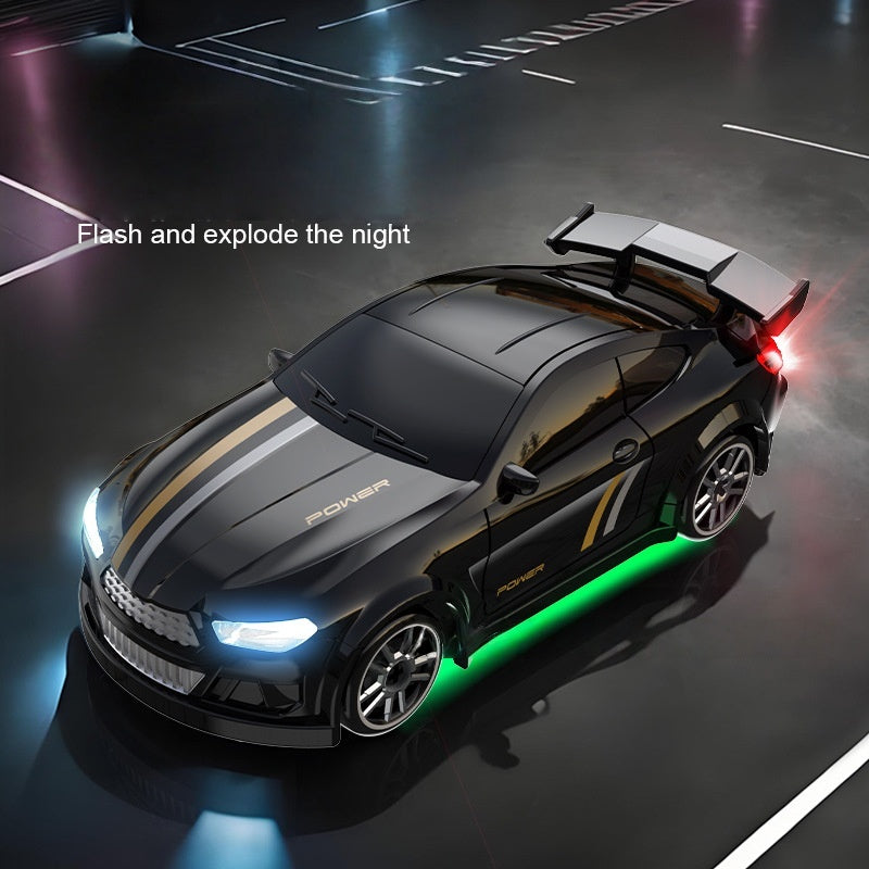 Black sports car with glowing lights on a dark road