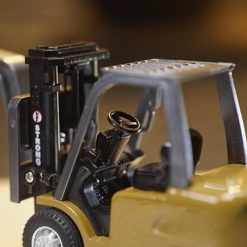 Close-up of a toy forklift with a blurred background